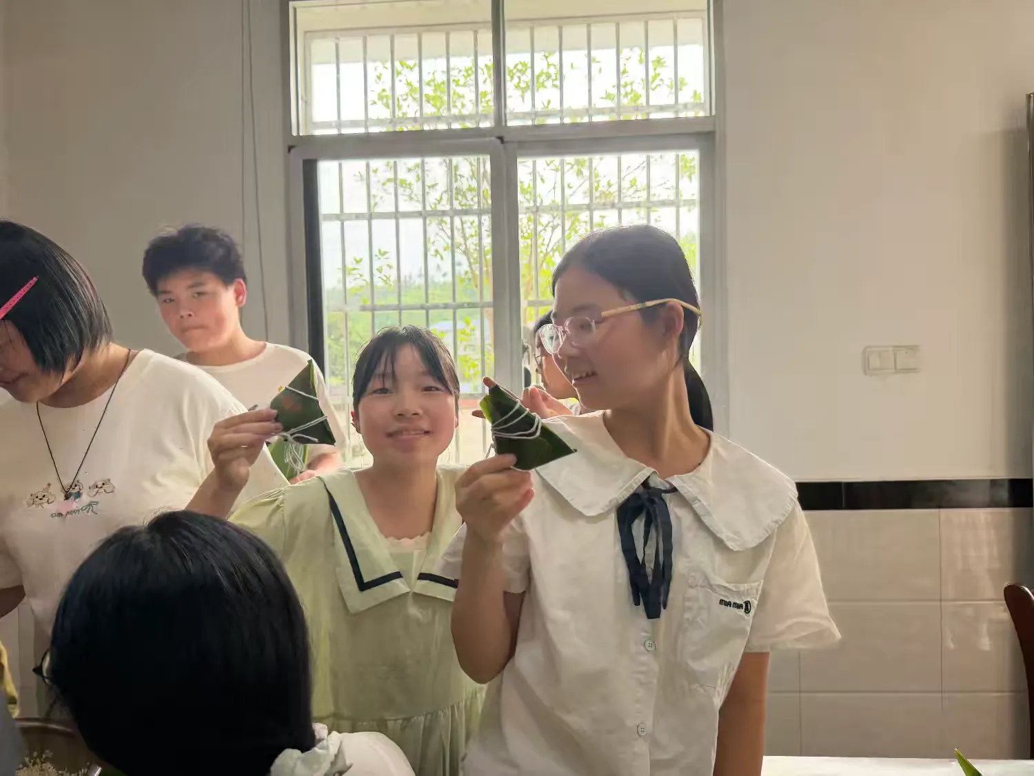 简篇-传承文化 传递温暖 ——记杨麟爱心小学"粽香情浓"端午主题活动 传承文化 传递温暖 ——记上饶市广信区汪村学校杨麟爱心小学"粽香情浓"端午主题活动